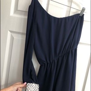 Romper, one sheer sleeve, w/ bling on cuff.